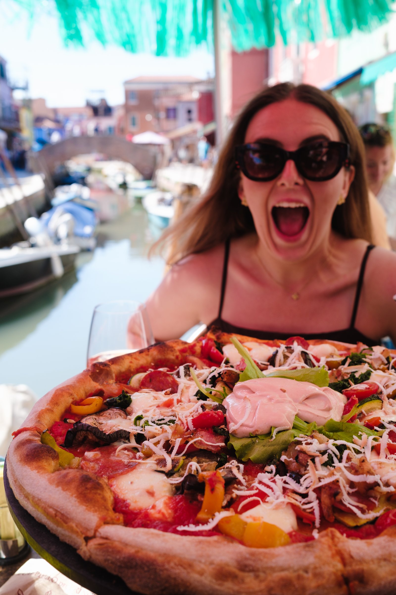 Kay with pizza on Burano