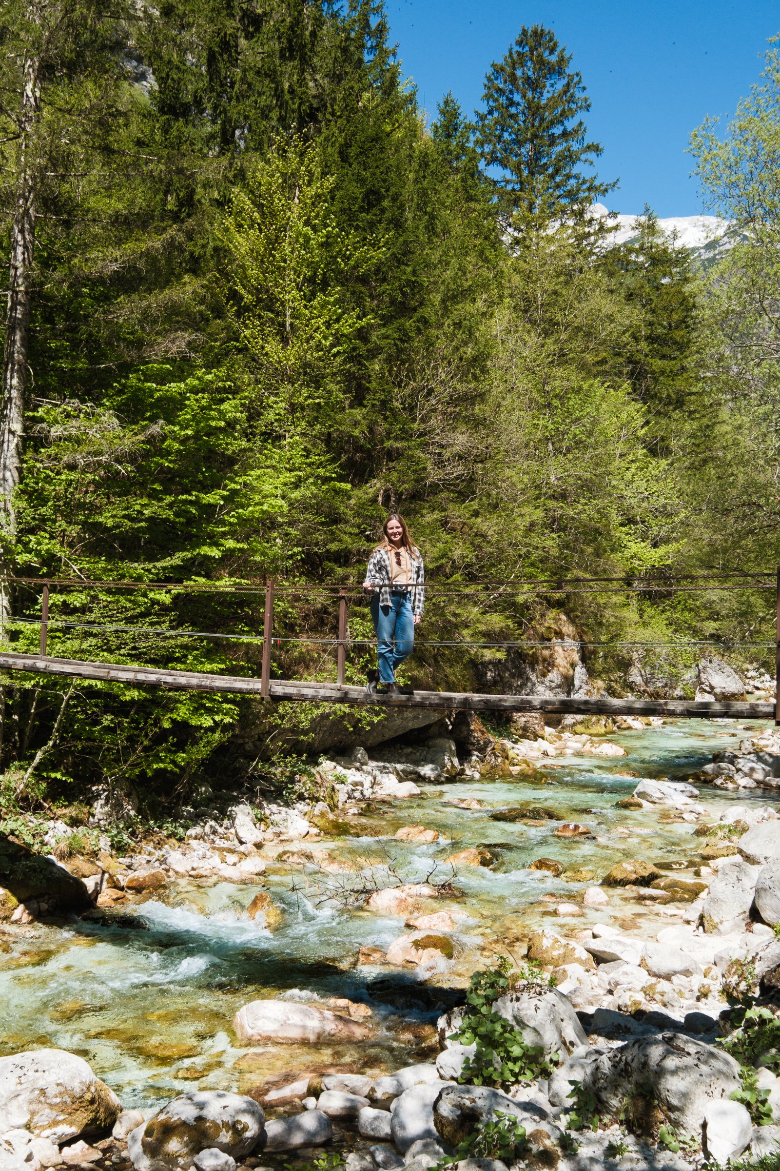 Kay on bridge over river