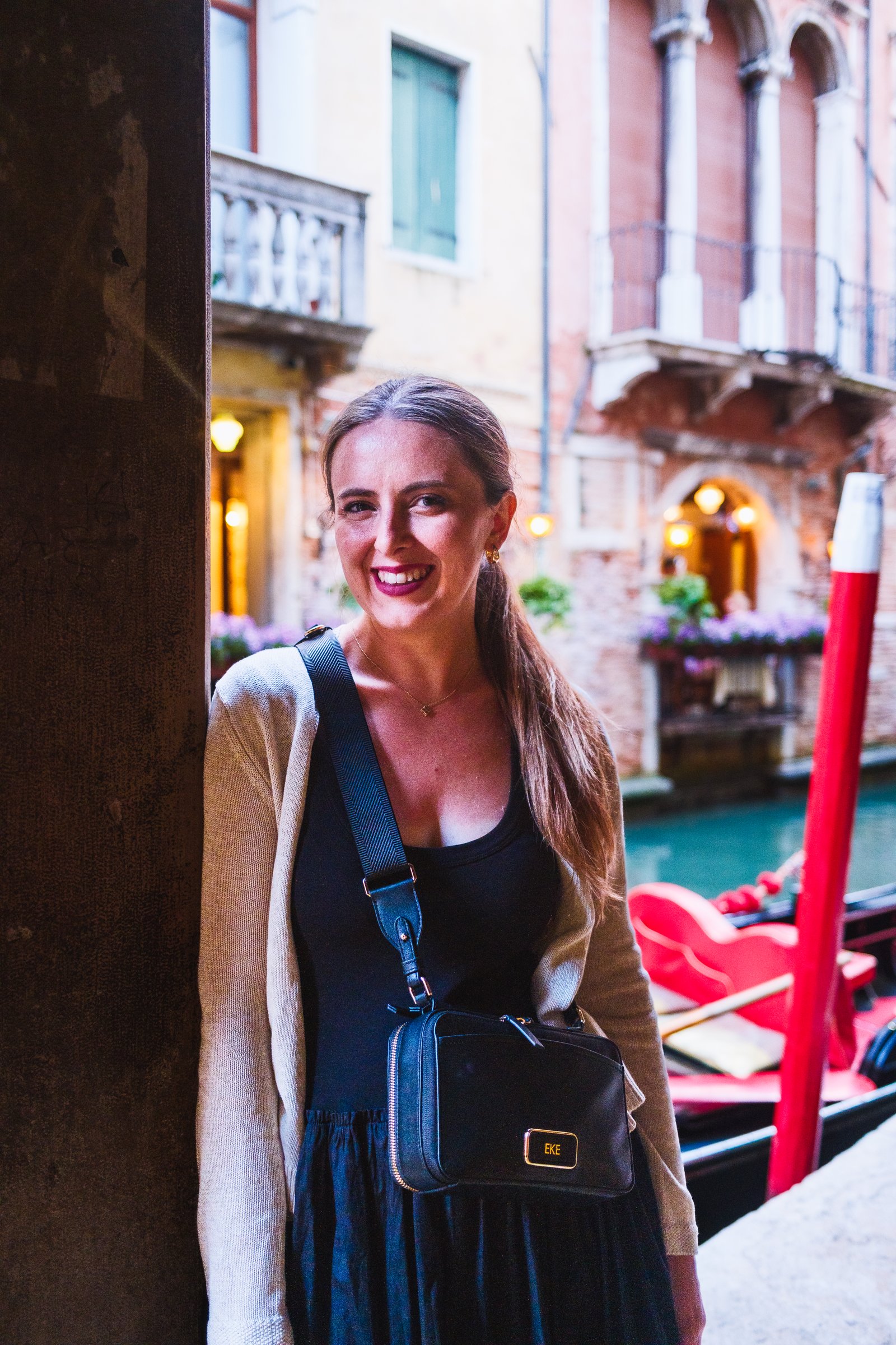 Kay by a canal at evening