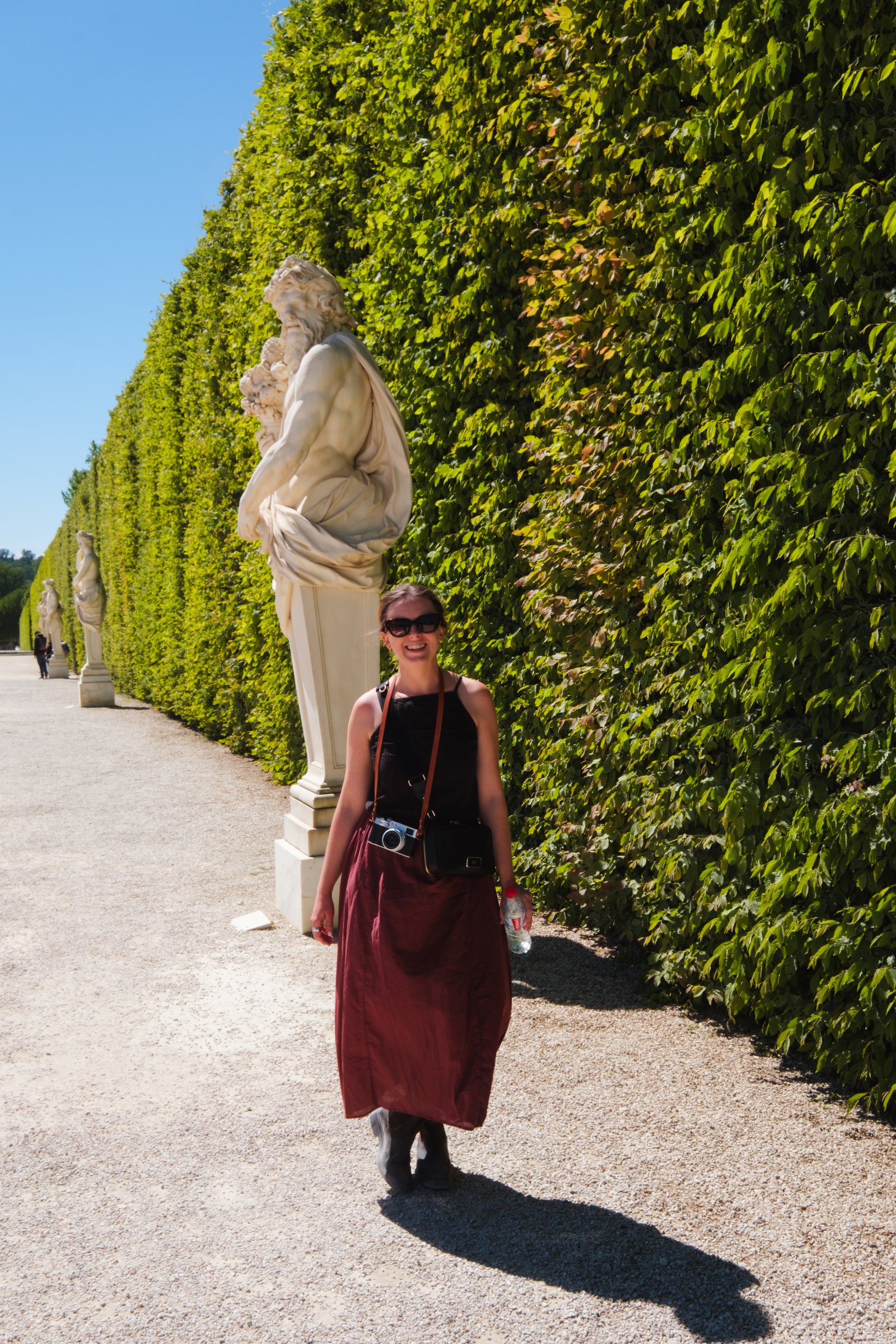 Kay by a statue